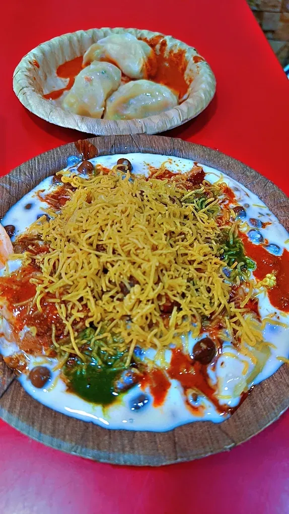 Papdi Chaat under curd, chutneys and a heap of sev