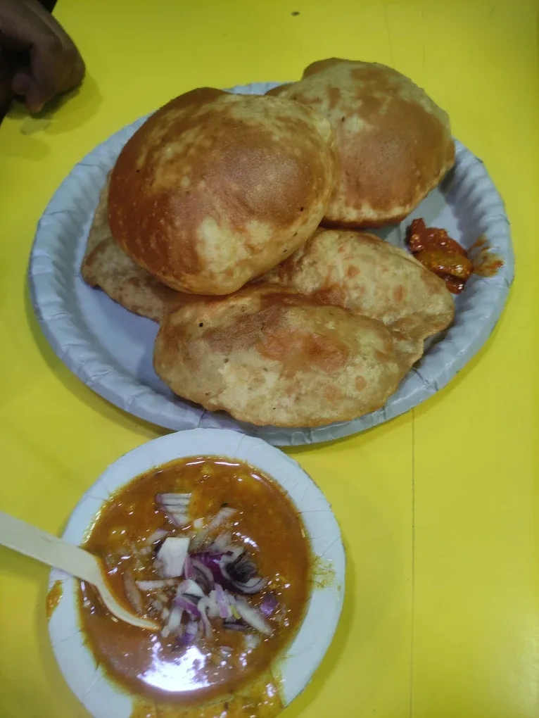 Poori Chola — puffed poori with chickpea chola